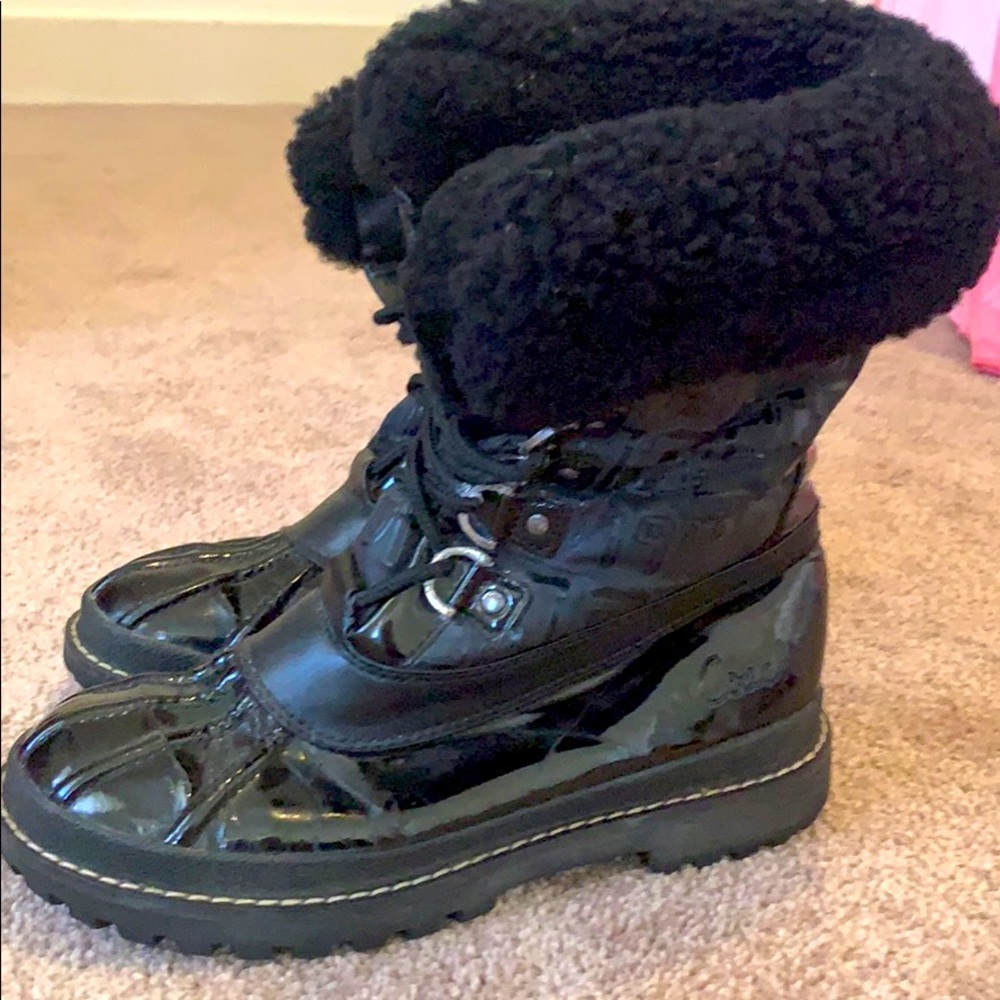 Black woman's Coach Winter boots